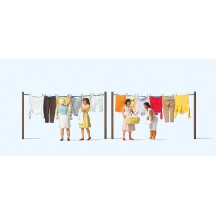 Women hanging laundry Women hanging laundry