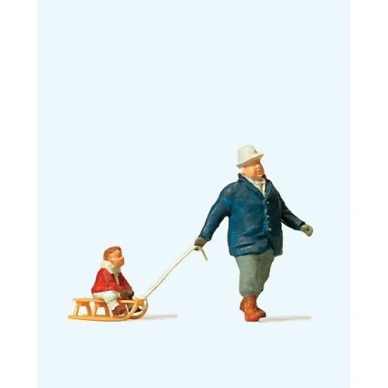Man pulling child on sled Man pulling child on sled